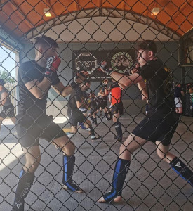 An image of two MMA fighters training.