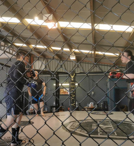 An image of two MMA fighters training.