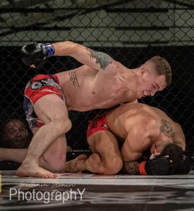 An image of two MMA fighters fighting.