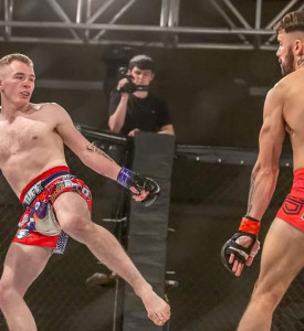 An image of two MMA fighters fighting.